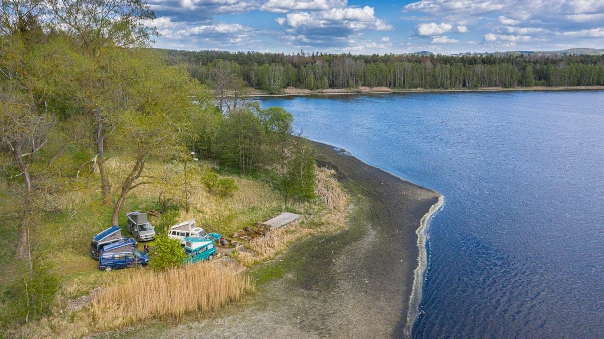 Aerial view of campervans by a lake